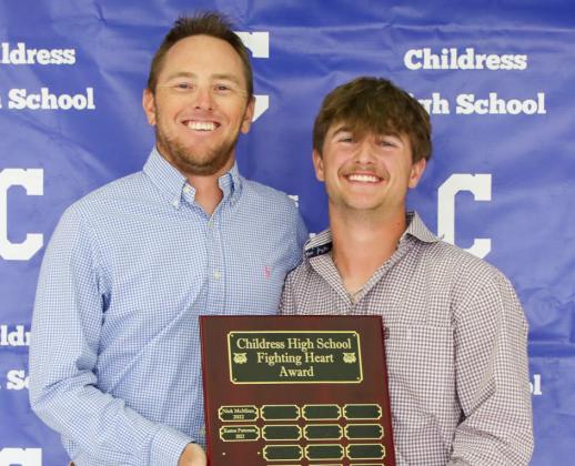 Corbyn Taylor receives the Fighting Heart Award, presented by Coach Brady Blake.