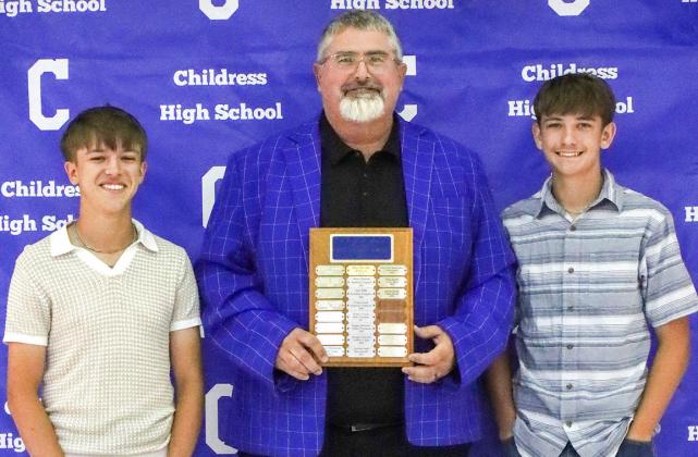 Ashton Preston, left, and Jered Preston, right, receive the Bobcat Golf Co-Most Valuable Player Award, presented by Coach Trenton Boyd.