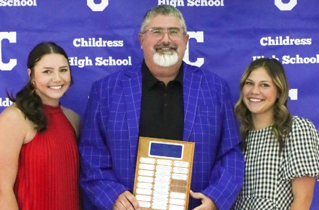 Colee Cox, left, and Emma Jalomo, right, receive the Lady Cat Golf Co-Most Valuable Player Award, presented by Coach Trenton Boyd.