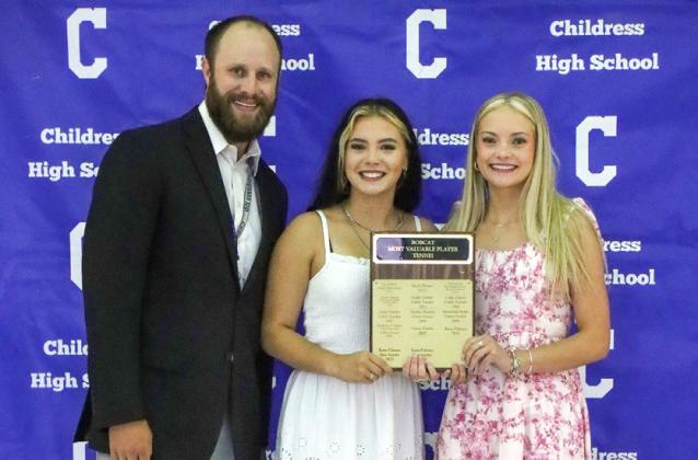 Channing Burnett, right, and Tandi Thomas, center, are awarded the Lady Cat Doubles Most Valuable Player Award, presented by Athletic Director Bo Helm.