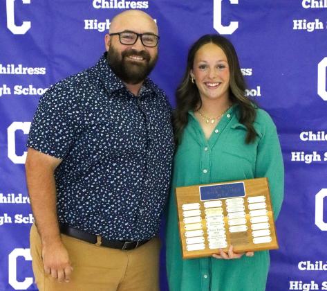 Bethani Spencer receives the Lady Cat Track Most Valuable Player Award, presented by Coach Kolby Pool.