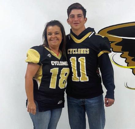 Senior Jase Middleton swaps with Carla Murphy.