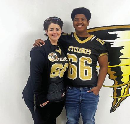 Senior Brandon Pierson swaps with Kayla Gilchrest.