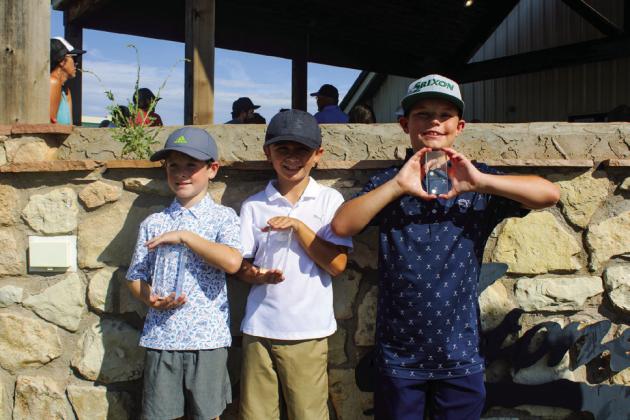 Kindergarten through third-grade boys accept end-of-year awards. From left: Rylan Hickman, first, Childress; Landry Wynn, second, Altus, Okla.; and Mark Robinson, third, Altus, Okla. Not pictured: Luke Latimer, third, Childress.