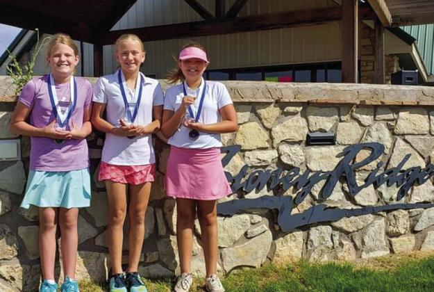 Fourth through fifth-grade girls accept end-of-year awards. From left: Emma Howard, first, Clarendon; Avery Wilson, second, Quanah; and Ella Belle Conley, third, Quanah.