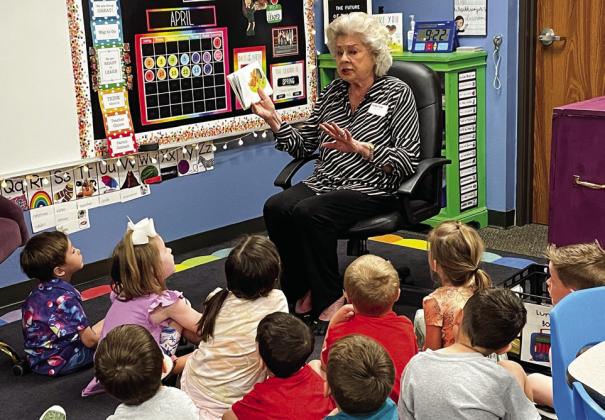 Collingsworth County Retired School Personnel Association (CCRSP) member Vada Wood reads to Megan Wischkaemper’s pre-kindergarten students Friday, April 14. An annual event, members of CCRSP donated books so that each student in Head Start, pre-kindergarten and kindergarten received a book to take home. Courtesy Photos