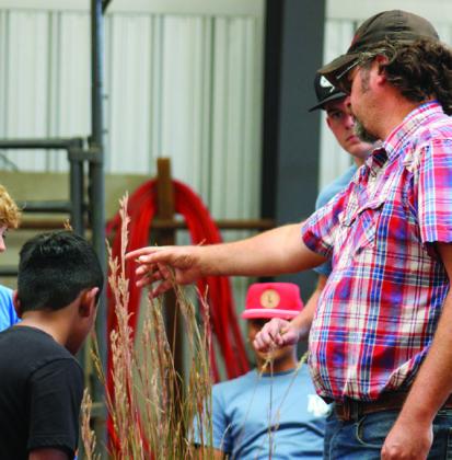United State Department of Agriculture (USDA) Natural Resources Conservation Service Center Childress District Conservationist Randall Linex teaches students about Texas native grasses during the 25th Annual Childress County Ag Day in October. The Red River Sun/Elizabeth Tanner