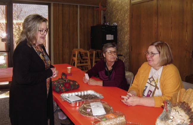 Ann Ricks, standing, visits will Lila Hoobler, left, and Susan Leary prior to selecting a baked dessert at the Childress Methodist Women’s Annual Bazaar and Food Fest Saturday, Nov. 18. Photos by Grace Holman