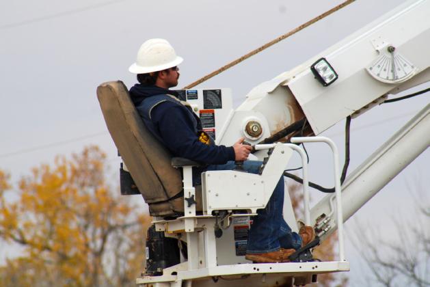 Six solar LED light posts are installed at Fair Park Friday, Dec. 15. The Red River Sun/Elizabeth Tanner