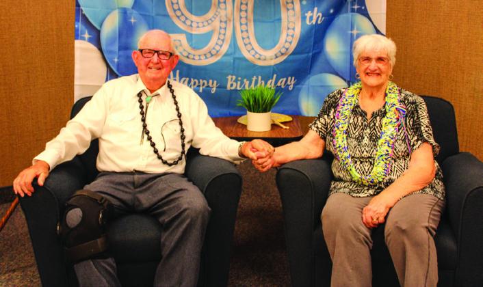 The Red River Sun/Elizabeth Tanner Jimmy Charles “J.C.” Keys, alongside wife Dollie, celebrates his 90th birthday during a reception at the Church of Jesus Christ of Latter-Day Saints Saturday, Sept. 10 – a day prior to his actual birthday.