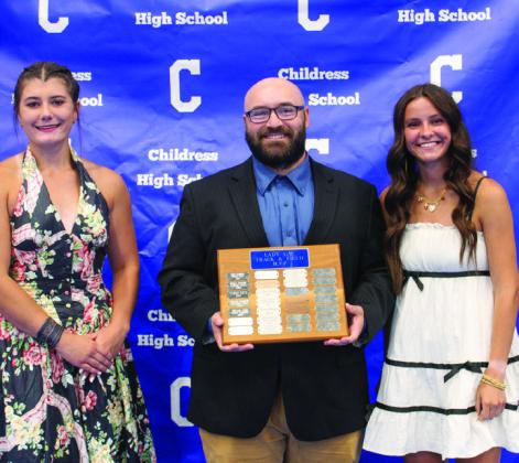 Girls’ head track coach Kolby Pool, center, awards Lady Cat Track Most Valuable Player (MVP) Chloe Churchill, right, and Lady Cat Field MVP Taylor Wiseman, left.