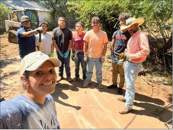 Organizer Becky Reyes, front, takes a selfie of her volunteer team that made a difference in a woman’s life, cleaning up her property and making her home attractive. Back, from left: Amos Molina, Reyes Garcia, Daniel Garcia, Jacob Garcia, Christopher Reyes, Troy Molina and Chris Reyes. Courtesy Photo