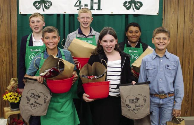 Intermediate Division Back row, from left: Broden Henry, second-place healthy dessert; Sterling Bruce, first-place main dish; Bryson Session, first-place side dish. Front row, from left: Quay Bruce, first-place appetizer; Libby Sanford, first-place healthy dessert; Kole Eikman, second-place appetizer.