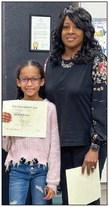 Austin Elementary School third-grader Jaedah Casas receives her Superintendent’s List certificate from Memphis Independent School District (ISD) Trustee Charlotte Maddox. Photos Courtesy of Memphis ISD