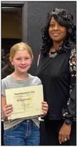 Austin Elementary School fifth-grader Baylee Altman receives her Superintendent’s List certificate from Memphis Independent School District (ISD) Trustee Charlotte Maddox.