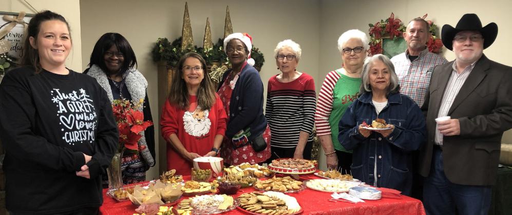 The Red River Sun/Bev Odom Collingsworth County Museum Director Karen Caldwell and the Board of Directors welcome visitors for a Christmas Open House from 11 a.m.-4 p.m. Friday, Dec. 15 in the Ellis Art Center. From left: Emily Cantu, Mary White, Caldwell, Janie Brooks, Lameda Black, Nancy Harris, Lucinda Martindale, Jeff Thomas, Scot Martindale.