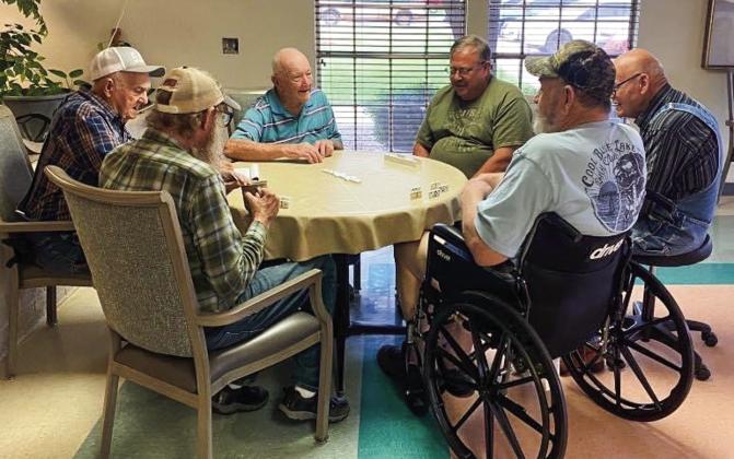 Volunteers, clockwise from left, Joe Stewart, Harry Stallings, Dale Day and John Lively compete with Tommy Baker and Steven Tucker during a recent domino challenge at Wellington Care Center. The volunteers report that a good time was had by all participants. Courtesy Photo