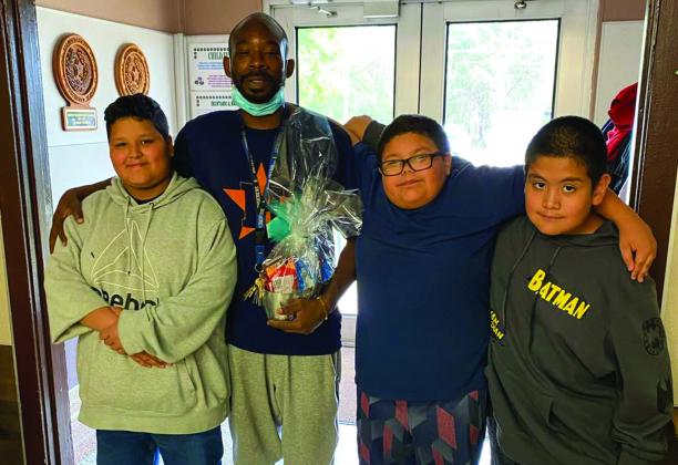 Austin Elementary School students Miguel Espinoza, Francisco Escovedo and Ayden Lucero thank custodian Anthony Johnson. Photos Courtesy of Memphis ISD