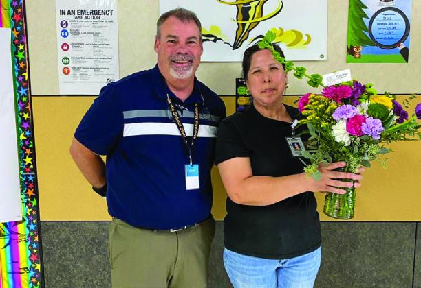Memphis Middle School Principal Wes Hardin thanks custodian Maria Lopez.