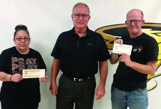 Memphis High School Principal Richard Hutcherson thanks custodians Beatrice Torres and JD McMahan.