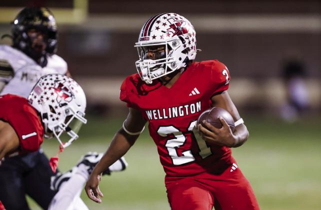 Wellington running back Travon Lewis (21) looks for yards against Wheeler during the Skyrocket’s District 5-2A Division II win Friday, Nov. 1. Press Pass Sports/Carter Pirtle