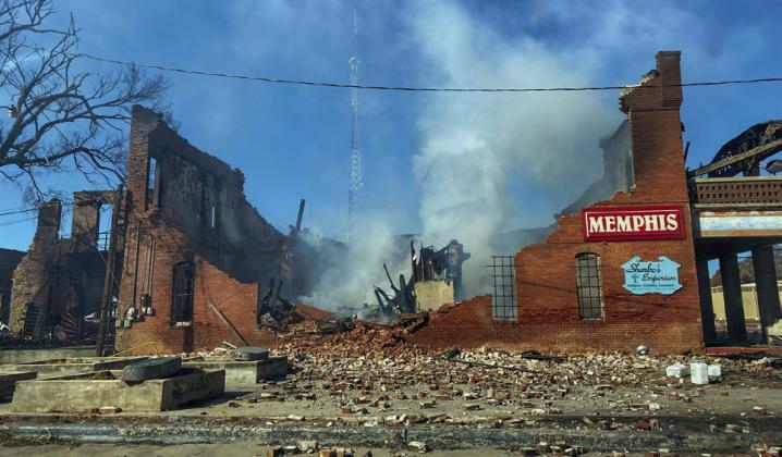 Still smoldering, the former Sharbo’s Emporium lays in rubble following a multi-structure fire on the eastside of the Memphis downtown square Monday, Feb. 21. Shari Watson