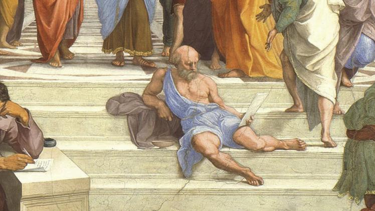 “The School of Athens” by Italian painter Raphael, a ca. 1510 fresco, shows a scene devoid of stadium seats. The unkempt philosopher Diogenes appears nevertheless to have made himself comfortable on the stone steps. The much-reproduced scene is in the public domain. Courtesy Image