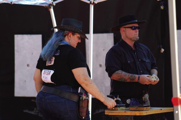 DFW gunslinger Brad Quick, right, competes in the X-Treme Fast Draw Association (X-FDA) Memphis District 1 Championship, hosted by the Texas Panhandle Pistoleros, at the Hall County Picnic Saturday, Sept. 17. For additional photos, see 10A.