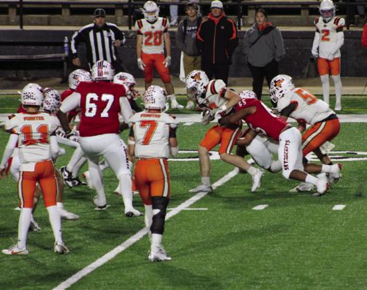 Skyrocket Yobani Moreno (65) downs Petrolia’s ballcarrier with help from Jovani Munn (67) Thursday, Nov. 14 at Cameron Stadium in Lawton, Okla.