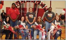 Rocket Regiment senior Cecilia Granadoz accepts the honor of Band Queen during the Friday, Sept. 15 homecoming pep rally festivities in the Wellington High School gymnasium. Front row, from left: second runner-u tie Addi Mock, first runner-up Kali Brewer, Granadoz, second runner-up tie Cortlyn McKinley. Back row, from left: junior escorts Jovani Munn, Jacob Klassen, Jontae Roland. The Red River Sun/Bev Odom