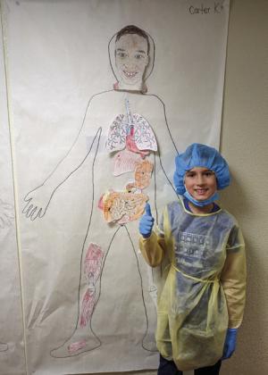 Carter Keys displays his human body.