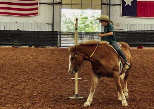 Childress 4-H Horse Club practices barrels,poles