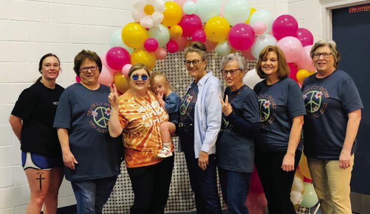 Cancer survivors and cancer fighters, including, from left, Dylan Skelton, Candy Powell, Tammy Sawyer, Kaydence Mixon, Sharon Starkey, Fran Eigenmann, Dianna Bohannon and Toni Cummings, pose for a portrait prior to the Saturday, May 3 Wellington Professional Women’s Walk for HUGS (Hearts United Give Support). The Red River Sun/Bev Odom