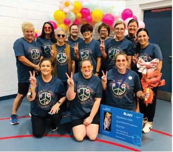 Membership of Wellington Professional Women’s Club unites for its Saturday, May 3 “Peace Out Cancer” Walk for HUGS (Hearts United Give Support). Front row, from left: Penny Davis, Whitney Wiebe, Natasha Mixon. Second row, from left: Carol Ann Daves, Pat Barnett, Annette Berstrom, Linda Duke, Maria Avalos. Third row, from left: Becky Lampe, Holly Statham, Candy Powell, Carrie Martinez.