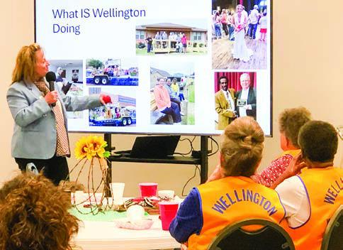 In her PowerPoint presentation, District 2-T1 Governor Deanna Porter commends the members of Wellington Lions Club for being a pro-active community service organization not only locally, but on the district, state and national levels as well.