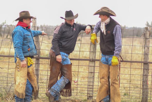Byron Bell, son Jackie Bell and cowboy Sawyer Sims find time for fellowship and fun during a recent cattle roundup on the Mill Iron Ranch.
