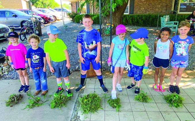 These aren’t weeds, they’re for the bees! Childress Methodist Church Disciple Kids, with the help of Ginger Snaps Gardening, owned and operated by Ginger Long, sow bee-friendly plants Tuesday, May 30 at Childress Healthcare Center. Photos Courtesy of Childress Methodist Church