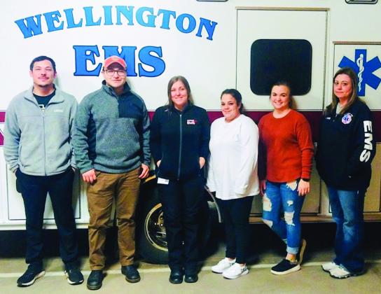Current Wellington Emergency Medical Technician (EMT) students, including Jared Casas, of Memphis, left, Bryan Yates, of Pampa, Rebekah Hawley and Chelsey Garno, both of Childress, instructor Carle Kemp and Krystle Tarver, both of Wellington, take a break during a recent class at the Wellington Emergency Medical Service (EMS) barn. Courtesy Photo