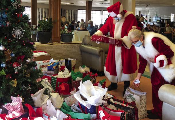 The Red River Sun/Bev Odom Family and friends join with residents and staff of Wellington Care Center for the annual Christmas tree festivities at 2 p.m. Thursday, Dec. 15 in the dining room. All partook in a buffet of finger foods, desserts and punch prior to the presentation of gifts by special guests Santa and Mrs. Claus.