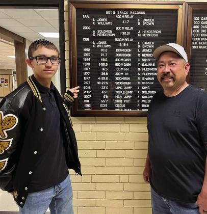 Memphis High School (MHS) junior Ryder Robison breaks the 3,200-meter school record with a time of 10:27.45 at the Bobcat Relays Thursday, March 23. Jesse Chavira, MHS Class of 1994, congratulates Robison on breaking his record time, which was recorded in 1992, 31 years ago. Photo Courtesy of Memphis ISD