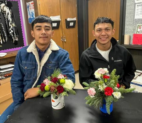Prior to Christmas break, Memphis High School floral design students complete their December projects, which include tin cans, painted and decorated to fit a winter or holiday theme, filled with fresh evergreen branches and fresh flowers. Photos Courtesy of Memphis ISD