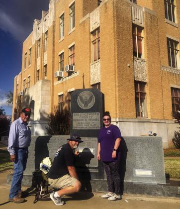 Dedicated to Collingsworth County veterans who made the supreme sacrifice, Kut In Stone owner Chad Ham, assisted by his wife, Heather Ham, of Vernon, etches omitted names of those killed in action on the Collingsworth County War Memorial on the grounds of the Collingsworth County Courthouse Thursday, Nov. 10. Glynn Moore Veterans of Foreign Wars Post 6439 Quartermaster Jr. Castillo, left, arranged for the names to be added.