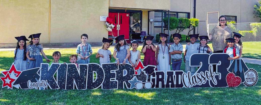 Leslie Wiebe’s kindergarten students gather with their classmates near the special yard art sign. From left: Yareli Contreras, Harper Cox, Hunter Huff, August Shotts, Finnley Peters, Blake Duke, Addison Anglin, Esperanza Ortiz, Kamryn Flores, Vivyan Valles, Kase Reyes, Qaasen Pereira, Luke Roberson, Jonathan Robles, Wiebe, Daisy Owen.