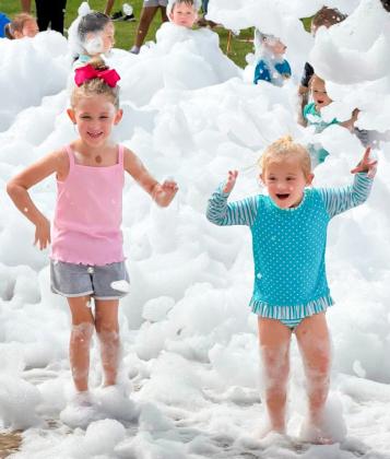 Summer readers frolic in library’s foam party