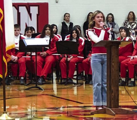 Wellington Junior High School eighthgrader Adeline Deady sings “God Bless the U.S.A.”