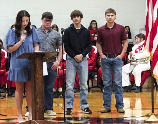 Brynlee Proffitt, left, recites “It is the Soldier,” by Charles M. Province; Hunter Hedrick reads “Freedom Isn’t Free,” by an unknown author; Logan Marshall recites “I Am the Flag,” by Ruth Apperson Rous; and Gunnar Guy reads “Take a Moment to Thank a Veteran,” by Joanna Fuchs.