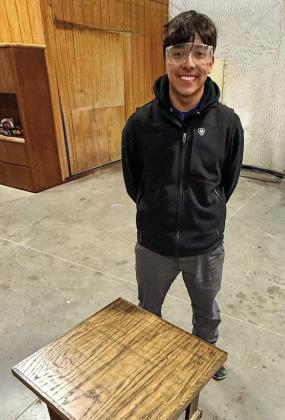 Memphis Middle School first-year woodworking student Steven Saucedo-Castillo creates a solid-oak end table. Finished in Jacobean stain and coated with clear satin, Saucedo-Castillo designed and built the table himself, according to Memphis Independent School District (ISD) woodworking instructor Ramiro Salaz. Memphis ISD