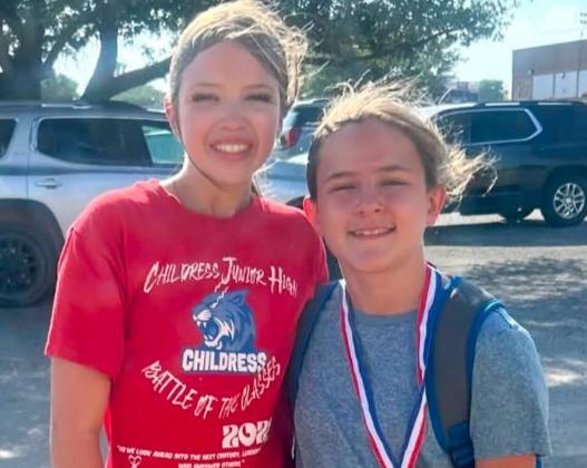 Tornado Twisters Raynee Arnn and Paisley Jackson take first- and second-place honors, respectively, during the Childress Little League Home Run Derby. COURTESY PHOTO