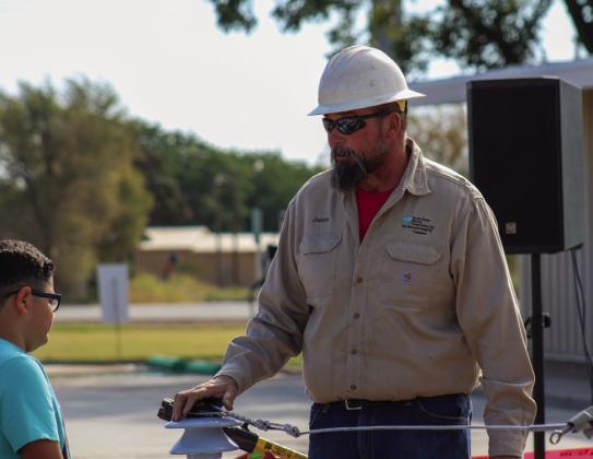 Journeyman Lineman Jason Smoot informs students of the importance of electrical safety.