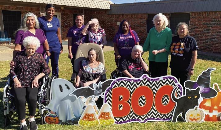 Wellington Care Center residents enjoy a cool, crisp, fall morning outing to relish in their “BOO” yard sign message from Ashley Long, longtime nurse for Wellington Independent School District. Not only did she send the card but chocolate candy, too. Hometown Yard Cards owner Carrie Skelton even left the message up for an extra day for the enjoyment of the residents and staff. Courtesy Photo